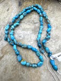 Castle dome turquoise (az) 4-7mm long rounded nugget beads, 16 inch strand